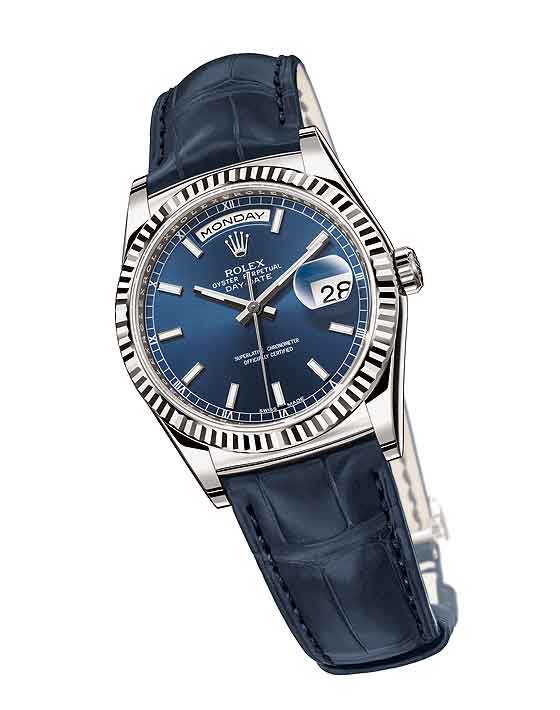 Rolex Day-Date: Rolex là hãng đồng hồ Thụy Sỹ cao cấp và rất xa xỉ, thường được coi là biểu tượng của địa vị xã hội. Rolex Day-Date ra mắt lần đầu vào năm 1953 với nhiều màu sắc khác nhau. Tuy nhiên, các quý cô có thể chọn mẫu Rolex Day-Date với mặt màu xanh, tạo cảm giác mát mẻ, dễ chịu, thoải mái và hoàn hảo. Đây là chiếc đồng hồ tự động chạy ngày giờ, được làm từ những chất liệu cao cấp và đắt tiền như kim cương, đá quý, vàng, bạc, platium… Với kiểu dáng đơn giản nhưng thanh lịch, sang trọng, Day-Date được rất nhiều ngôi sao nổi tiếng yêu thích.