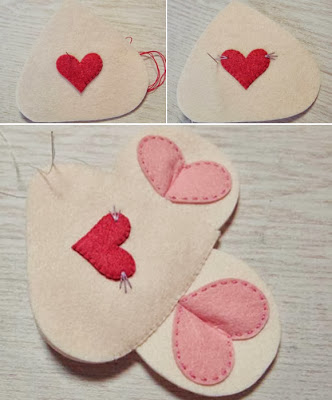 Tiếp theo, kh&acirc;u tr&aacute;i tim đỏ tr&ecirc;n 1 tấm đầu (số 1) l&agrave;m mũi, kh&acirc;u 3 đường chỉ m&agrave;u hai b&ecirc;n mũi l&agrave;m r&acirc;u. Đặt hai tấm phần đầu chồng l&ecirc;n nhau v&agrave; đừng qu&ecirc;n bỏ hai chiếc tai v&agrave;o phần tr&ecirc;n, kh&acirc;u viền m&eacute;p xung quanh. Ch&uacute; &yacute;, nhớ chừa đoạn trống kh&acirc;u nối với phần th&acirc;n v&agrave; nhồi b&ocirc;ng.