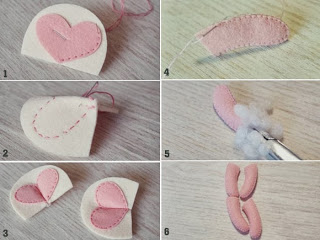 Kh&acirc;u tr&aacute;i tim m&agrave;u hồng tr&ecirc;n tấm vải m&agrave;u nude (số 2), gấp 1 đoạn ngắn ở phần giữa h&igrave;nh tr&aacute;i tim v&agrave; may lại, chiếc tai ho&agrave;n th&agrave;nh. Tương tự, l&agrave;m tai b&ecirc;n kia với tấm vải c&ograve;n lại. Đặt 2 tấm d&ugrave;ng để may phần tay, ch&acirc;n chồng kh&iacute;t l&ecirc;n nhau, kh&acirc;u đường viền m&eacute;p v&agrave; nhồi b&ocirc;ng v&agrave;o trong. Kh&acirc;u tương tự cho những chiếc c&ograve;n lại.