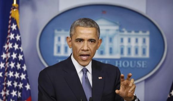 Tổng thống Mỹ Barack Obama trả lời c&acirc;u hỏi của ph&oacute;ng vi&ecirc;n về cuộc tấn c&ocirc;ng v&agrave;o h&atilde;ng Sony trong buổi họp b&aacute;o tại Nh&agrave; Trắng, h&ocirc;m 19/12/2014.