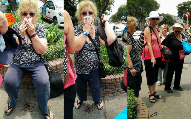 H&igrave;nh ảnh nữ du kh&aacute;ch bị vấp v&agrave;o m&oacute;c sắt tr&ecirc;n vỉa h&egrave;. Ảnh: D&acirc;n Tr&iacute; 