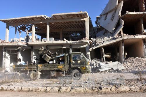 Chiến sự Syria:Nga v&agrave; lực lượng đối lập Syria b&agrave;n về ngừng bắn ở Aleppo. Ảnh: AFP/TTXVN