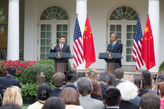 Tổng thống Mỹ Barack Obama (phải) v&agrave; Chủ tịch Trung Quốc Tập Cận B&igrave;nh (tr&aacute;i) tại cuộc họp b&aacute;o chung ở Nh&agrave; Trắng, theo tin tức mới cập nhật quốc tế 